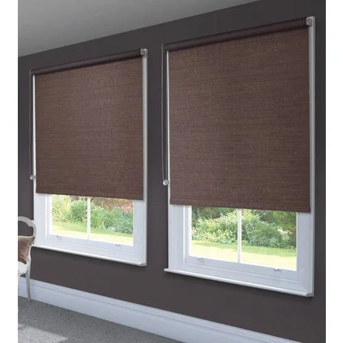 Homeowner admiring new blinds installed by Blinds by Design experts