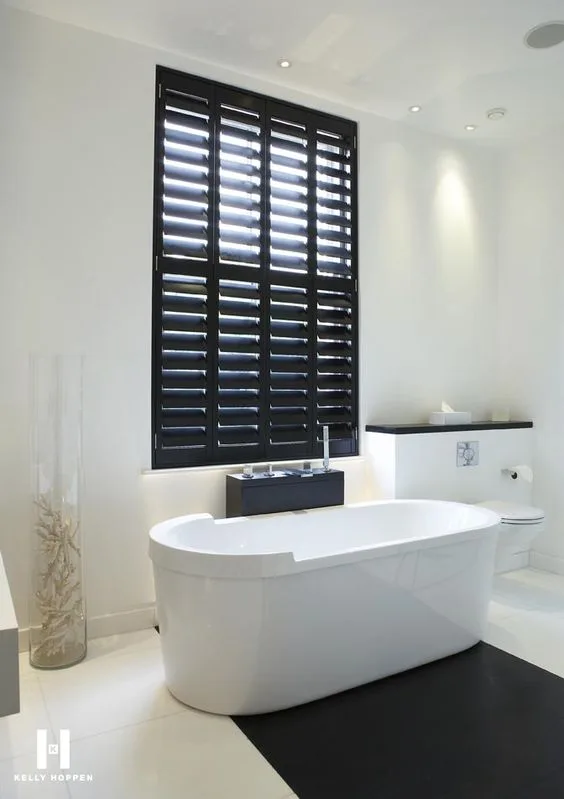 Custom wood blinds covering large windows in a Los Angeles home