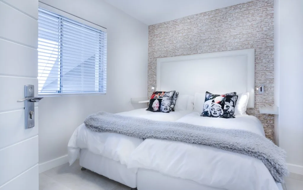 Blinds by Design expert installing modern window shades