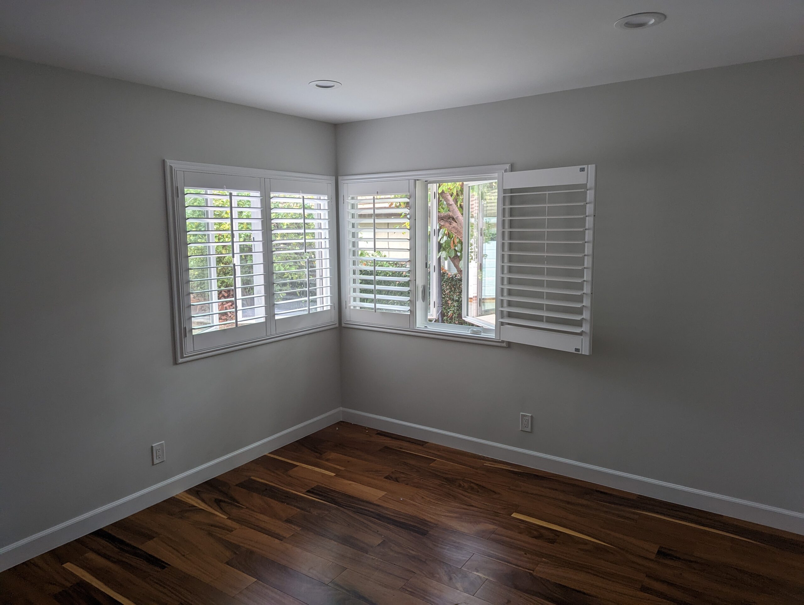 Modern plantation shutters installed in a Los Angeles County living room