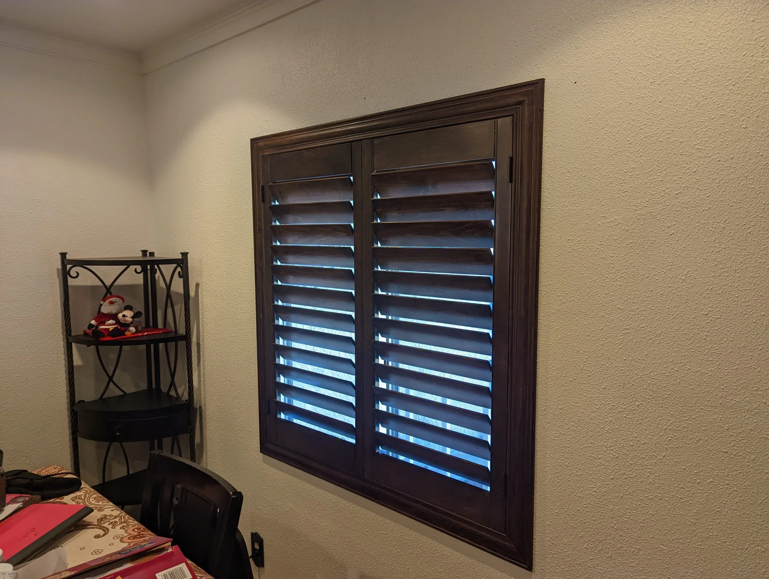 Blinds by Design installing white plantation shutters