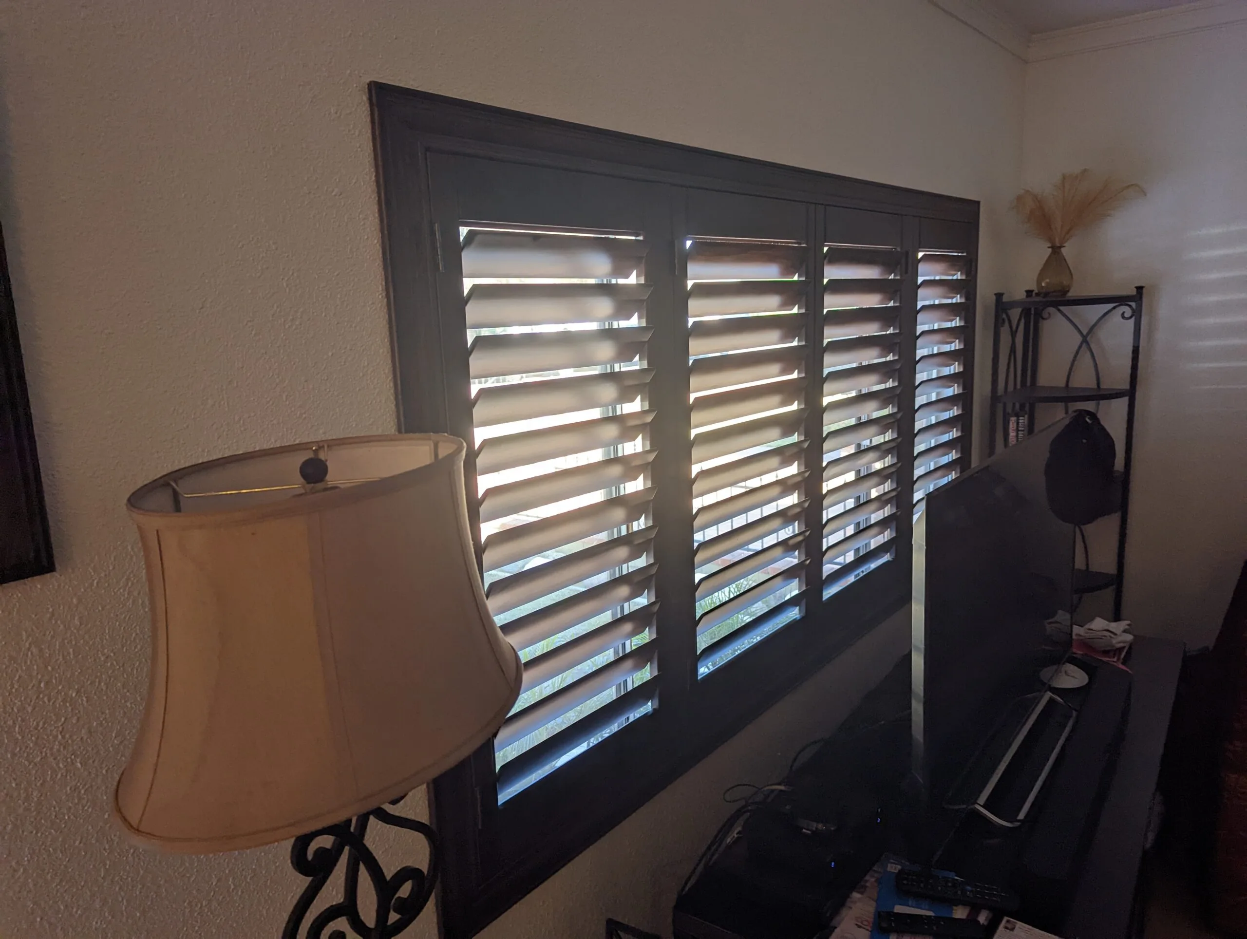 Custom wooden shutters on a La Mirada home's front window