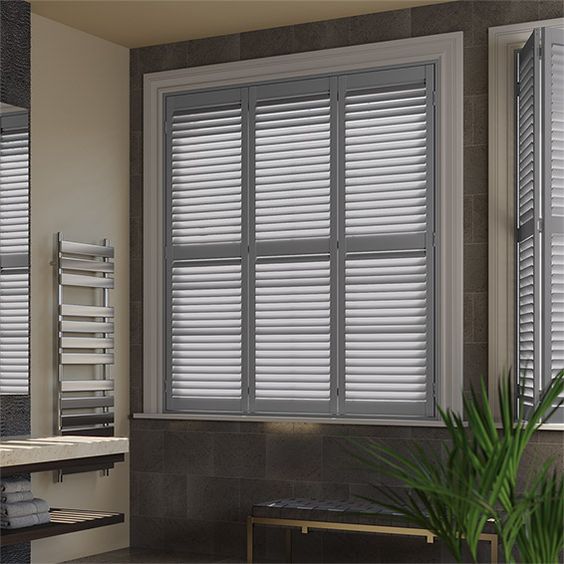 Custom wooden shutters on a La Mirada home's front window