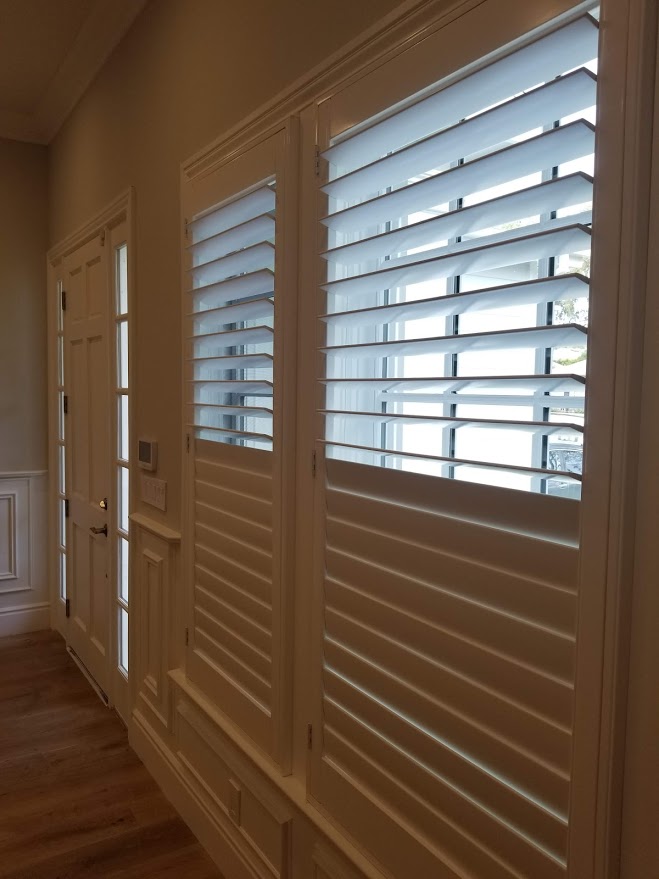 Modern plantation shutters installed in a Los Angeles County living room