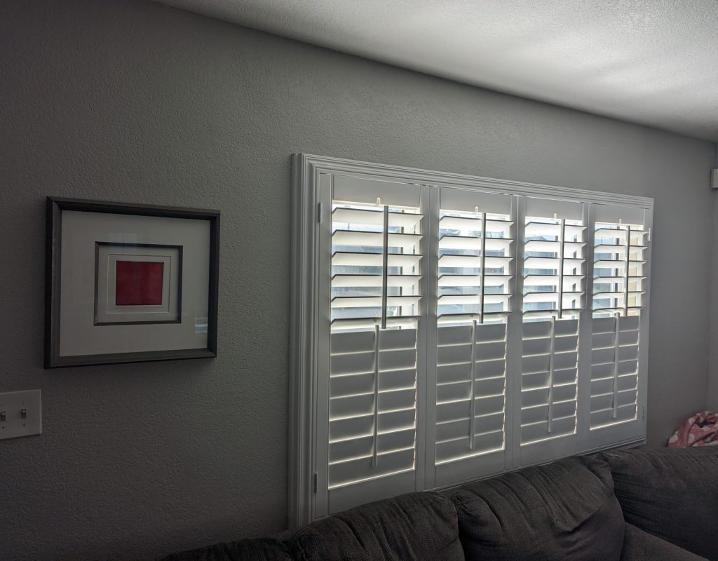 Blinds by Design installing shutters in Los Alamitos home