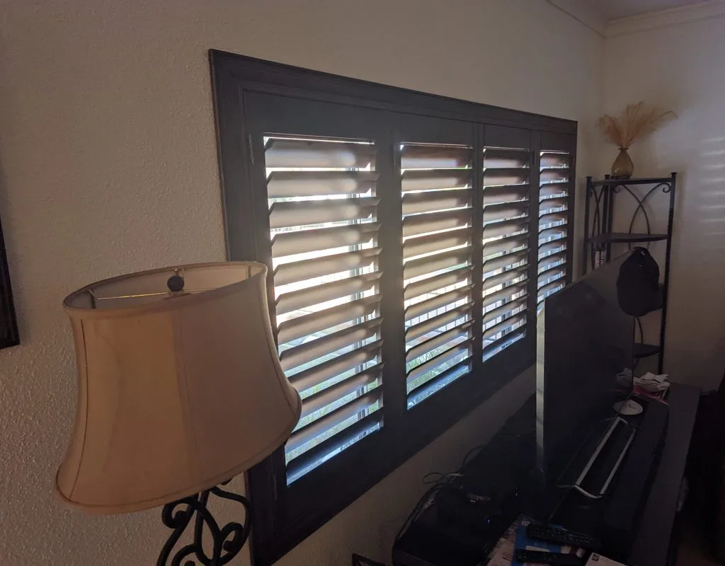 Custom wooden shutters on a La Mirada home's front window