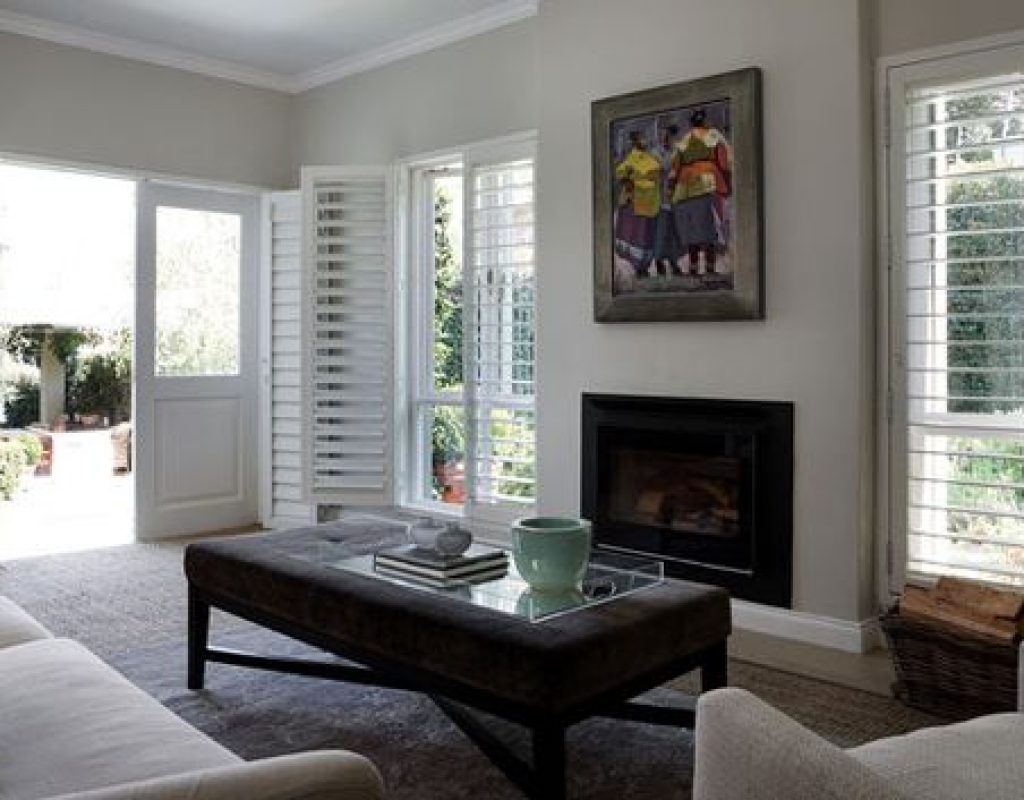 Modern plantation shutters installed in a Los Angeles County living room